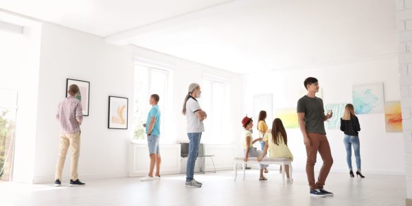 Group of people at exhibition in art gallery